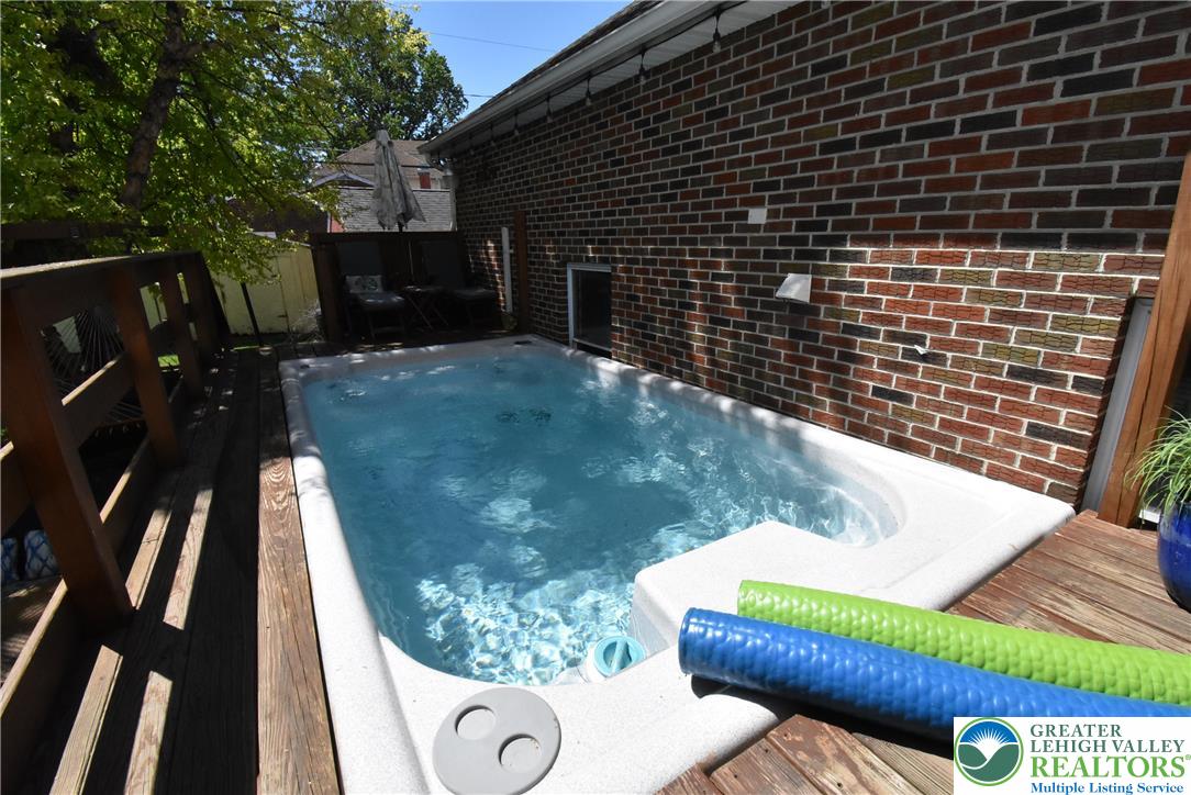 424 Grape Street Whitehall, PA 18052 - Photo 50 of 56 Swim against the current or realax in your private pool / spa on a wooden deck.