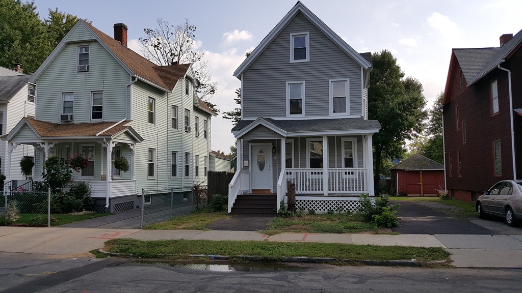 99 Alden Street Springfield, MA 01109 - Photo 1 of 21 a front view of a house with a yard