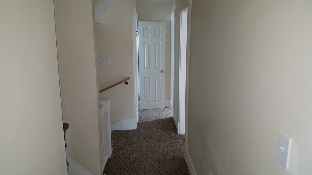 99 Alden Street Springfield, MA 01109 - Photo 13 of 21 a view of a hallway with an empty space