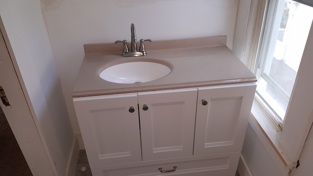 99 Alden Street Springfield, MA 01109 - Photo 17 of 21 a bathroom with a sink and mirror