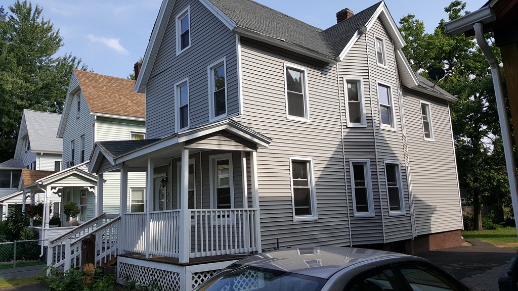 99 Alden Street Springfield, MA 01109 - Photo 2 of 21 a view of a house with a yard
