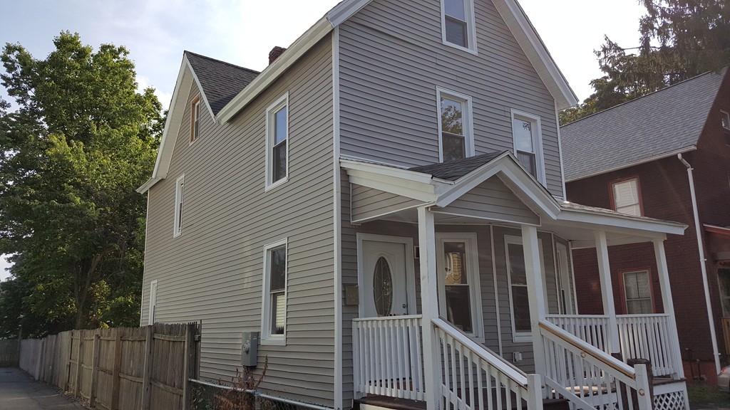 99 Alden Street Springfield, MA 01109 - Photo 4 of 21 a front view of a house with a porch