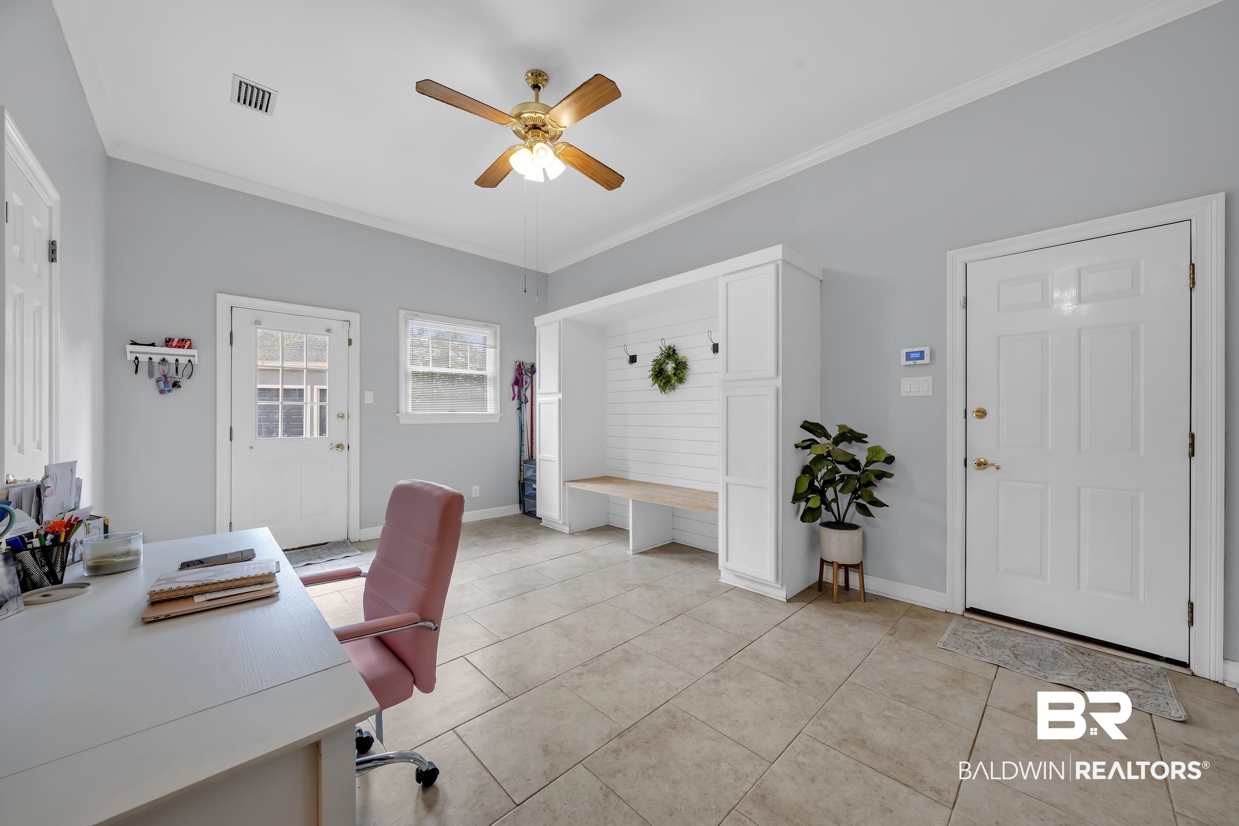 2858 Postoak Circle Mobile, AL 36693 - Photo 28 of 32 Home office with crown molding, a ceiling fan, and light tile patterned flooring