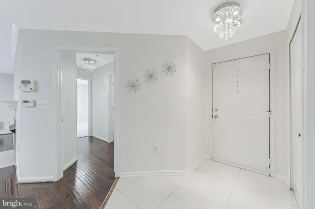 wooden floor in an empty room with a mirror