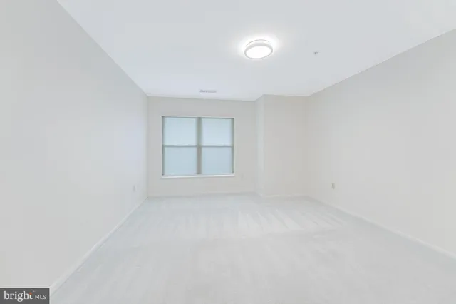 an empty room with a empty space and window