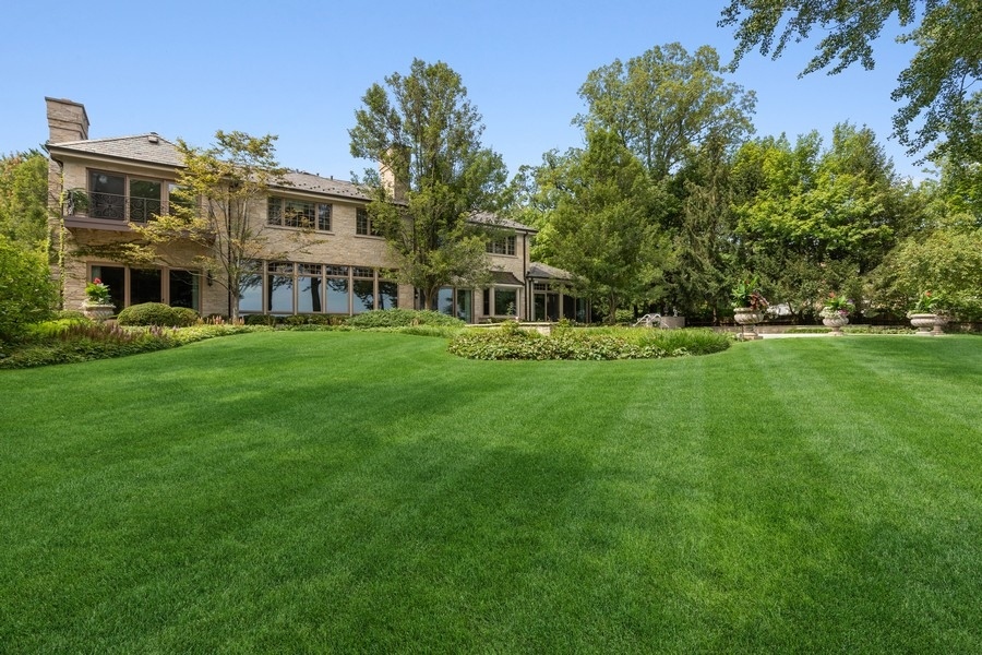 55 Stone Gate Road Lake Forest, IL 60045 - Photo 55 of 62 a view of a house with a big yard and large trees