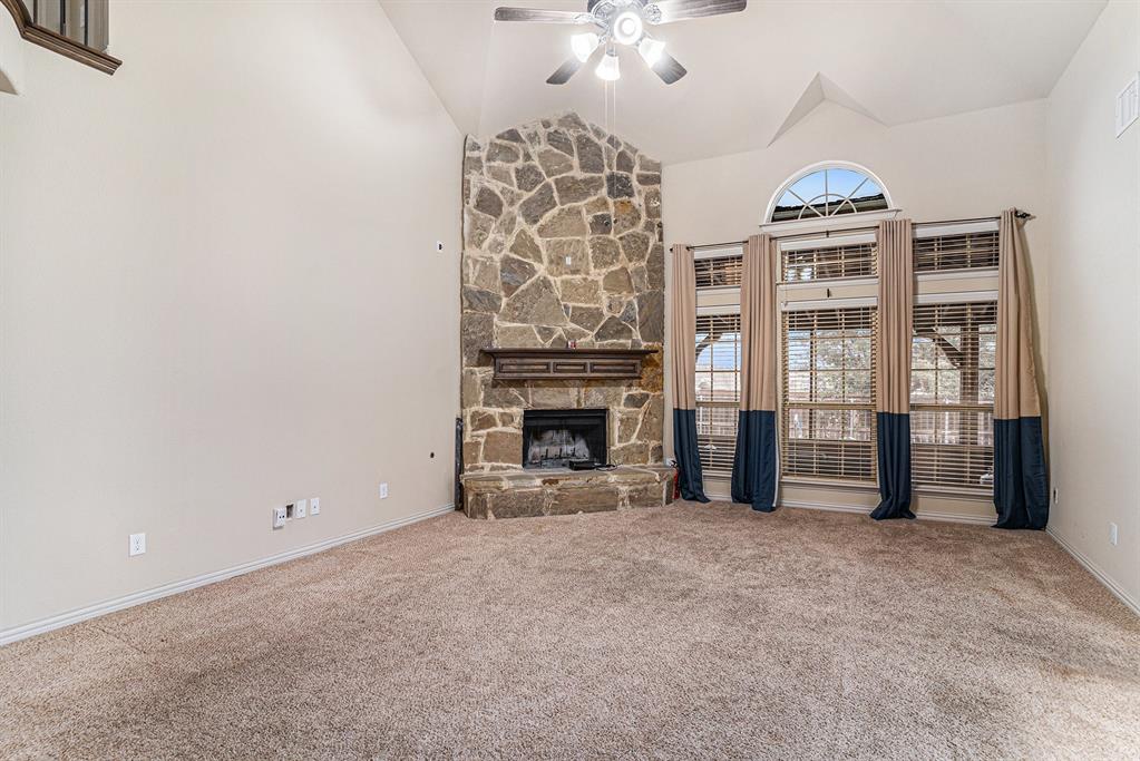6132 Falls Lake Road Fort Worth, TX 76179 - Photo 13 of 37 a view of an empty room with a fireplace