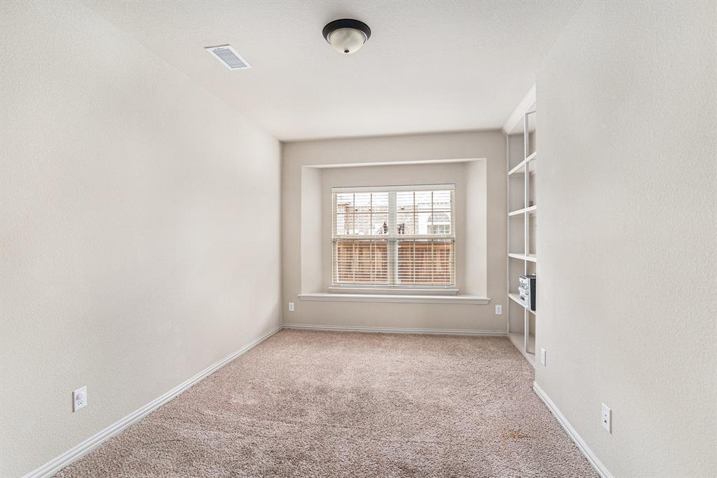 6132 Falls Lake Road Fort Worth, TX 76179 - Photo 14 of 37 an empty room with a empty space and a window
