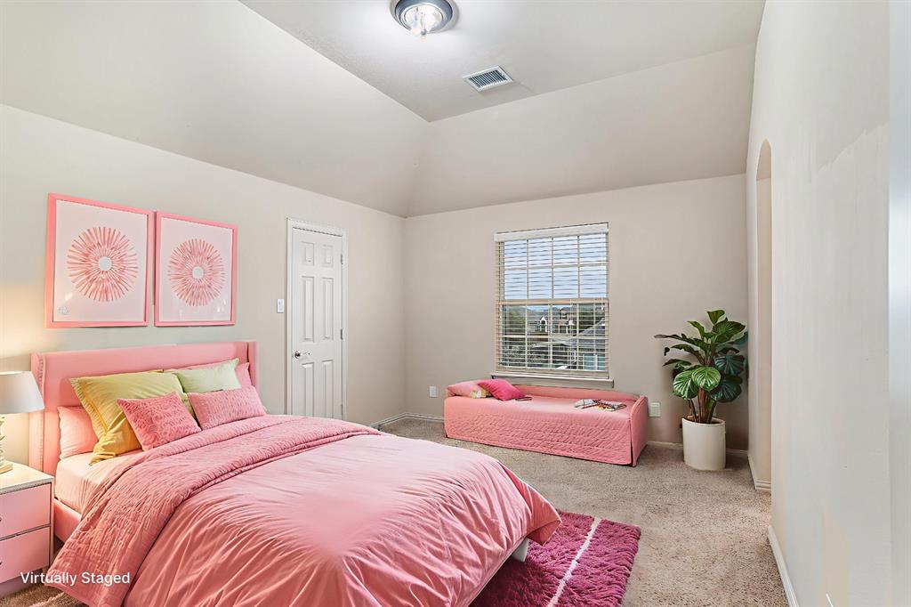 6132 Falls Lake Road Fort Worth, TX 76179 - Photo 21 of 37 a bedroom with a bed and a couch