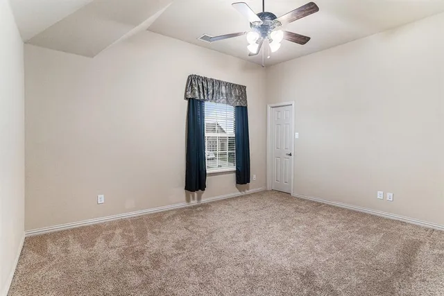 a bathroom with a sink mirror vanity and toilet