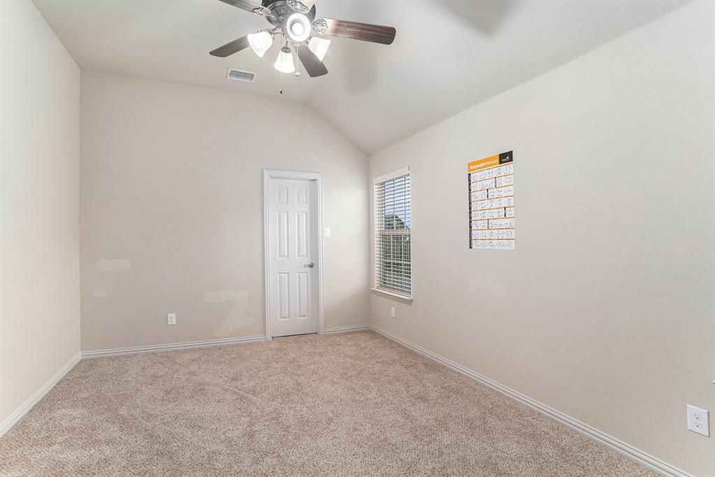 6132 Falls Lake Road Fort Worth, TX 76179 - Photo 29 of 37 an empty room with windows and fan