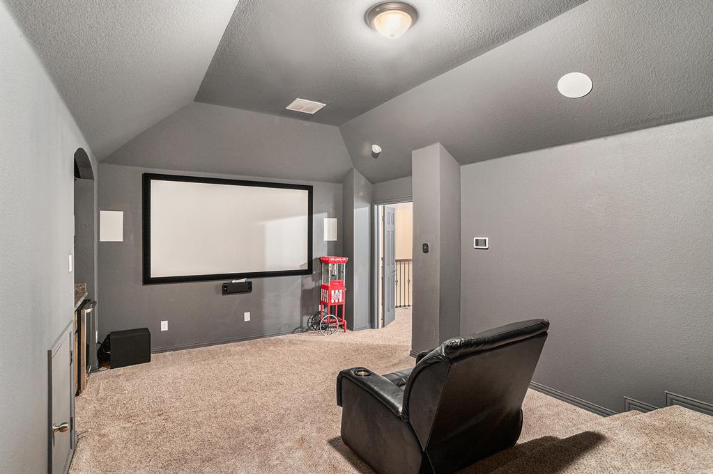 6132 Falls Lake Road Fort Worth, TX 76179 - Photo 31 of 37 a projector room with furniture