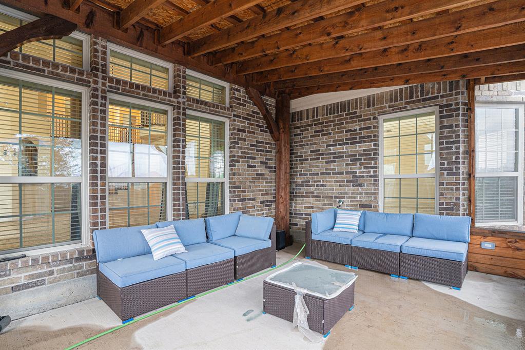 6132 Falls Lake Road Fort Worth, TX 76179 - Photo 35 of 37 a living room with furniture and a large window