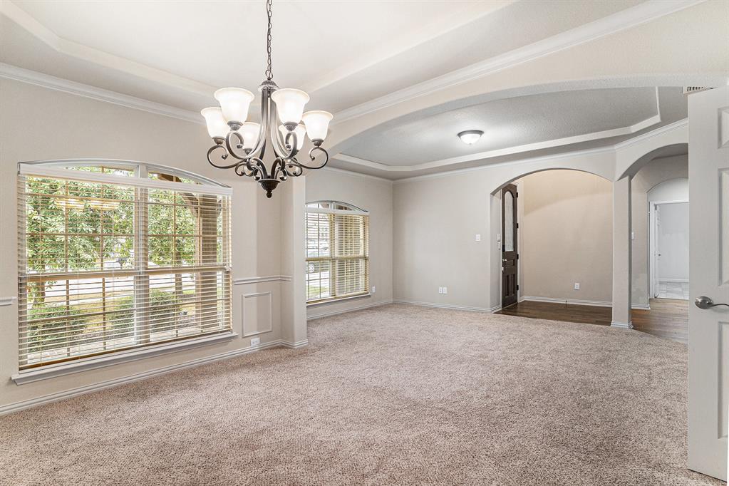 6132 Falls Lake Road Fort Worth, TX 76179 - Photo 5 of 37 a view of a big room with windows and chandelier