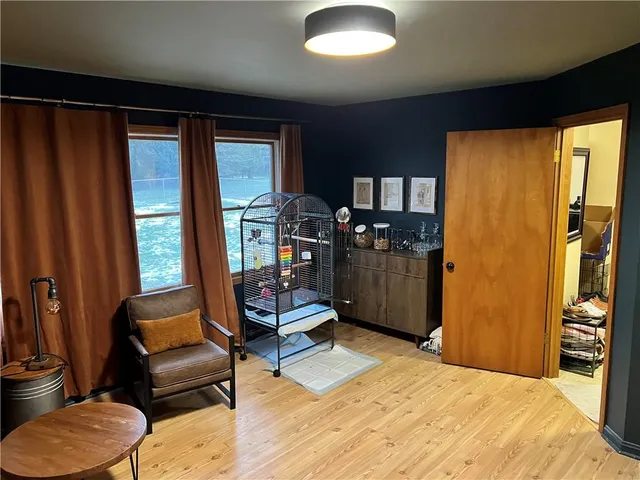 a bedroom with furniture and a closet