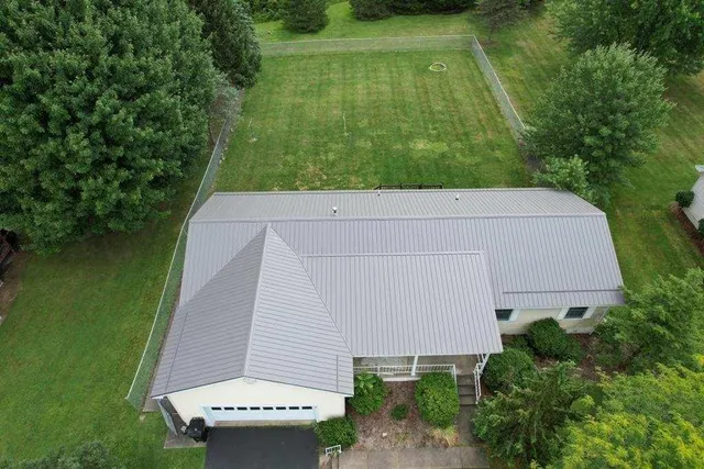 an aerial view of a house having yard