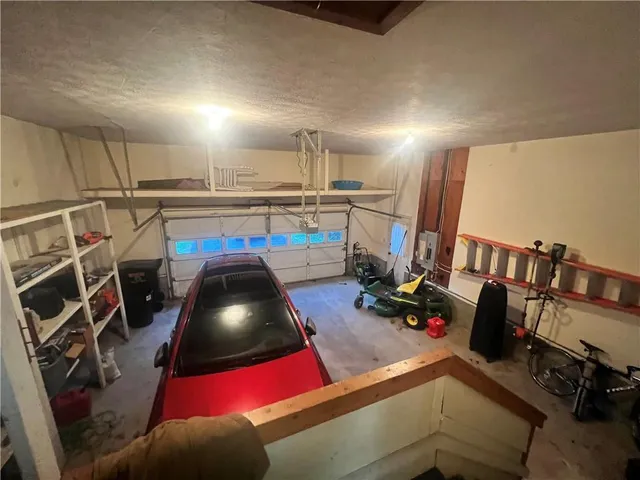 a view of a wooden bench next to a yard