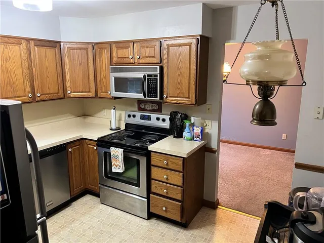 a kitchen with a stove and a microwave