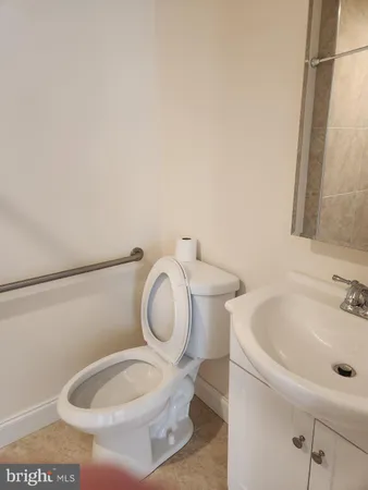 a bathroom with a toilet and a sink