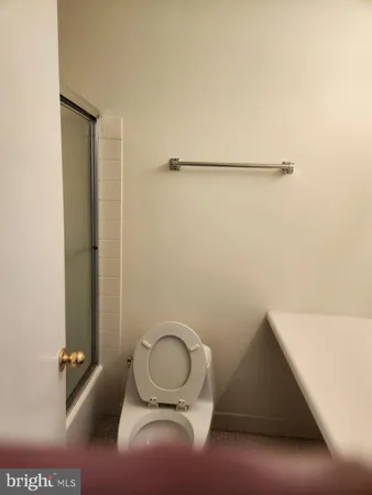 a bathroom with a toilet and a sink