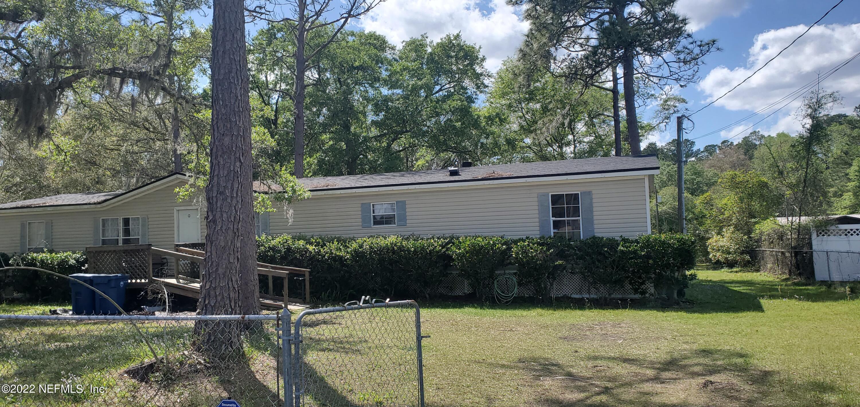 13464 Yellow Bluff Road Jacksonville, FL 32226 - Photo 1 of 20 a view of a house with backyard and plants