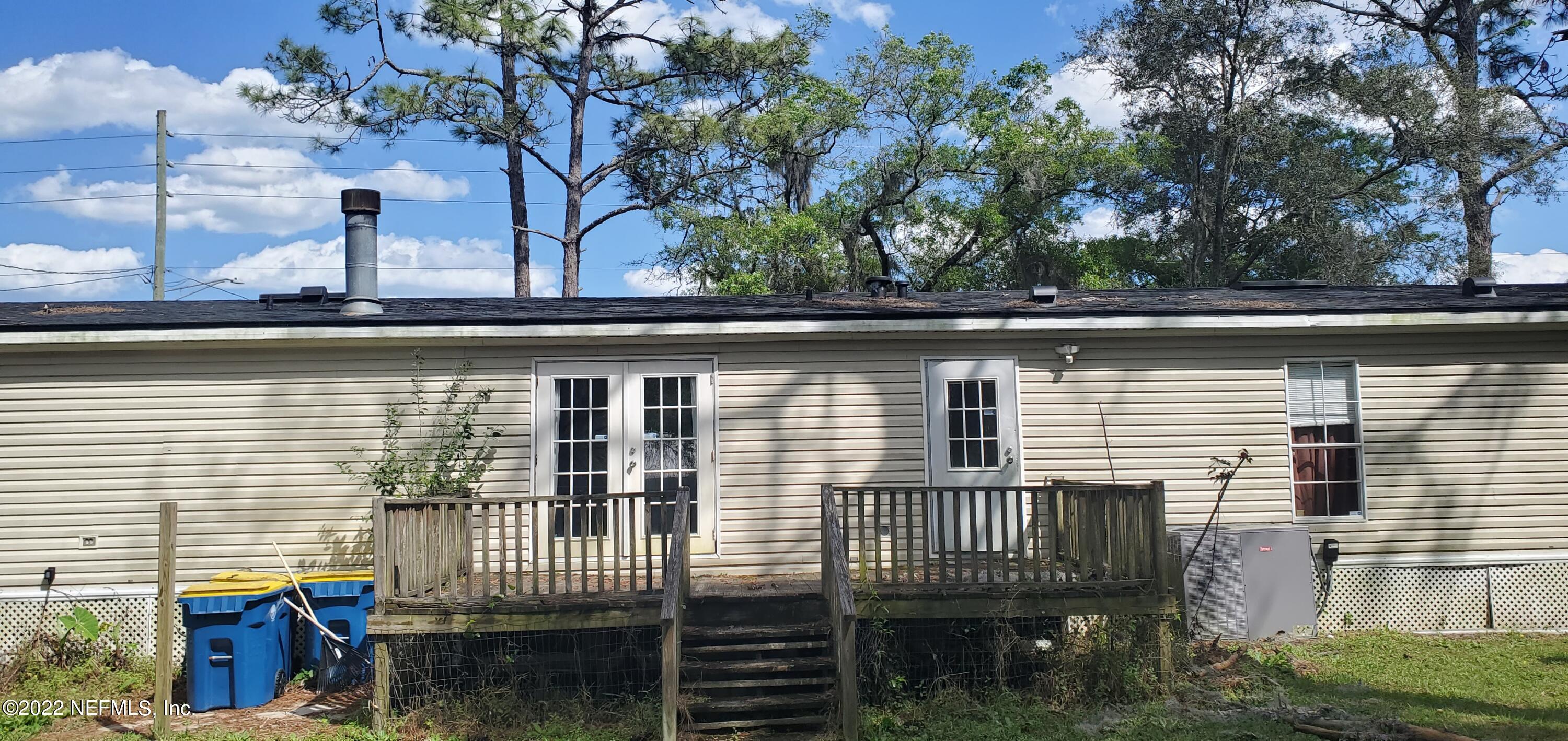 13464 Yellow Bluff Road Jacksonville, FL 32226 - Photo 11 of 20 a view of a brick house with a large window