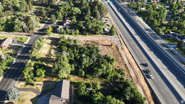 1792 Valley View Drive Layton, UT 84040 - Photo 6 of 18 Expansive undeveloped land parcel featuring mature trees and direct street frontage
