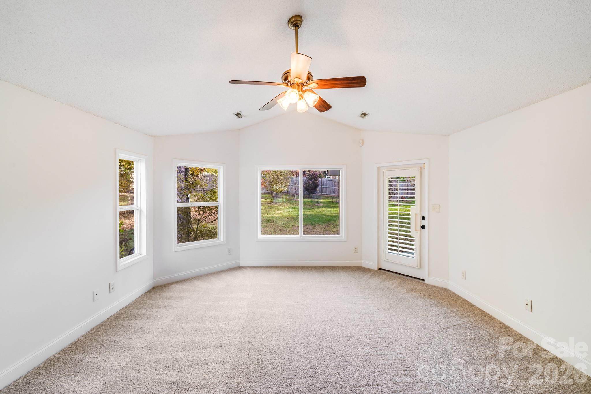 5329 Kuykendall Road Charlotte, NC 28270 - Photo 18 of 18 an empty room with windows and fan