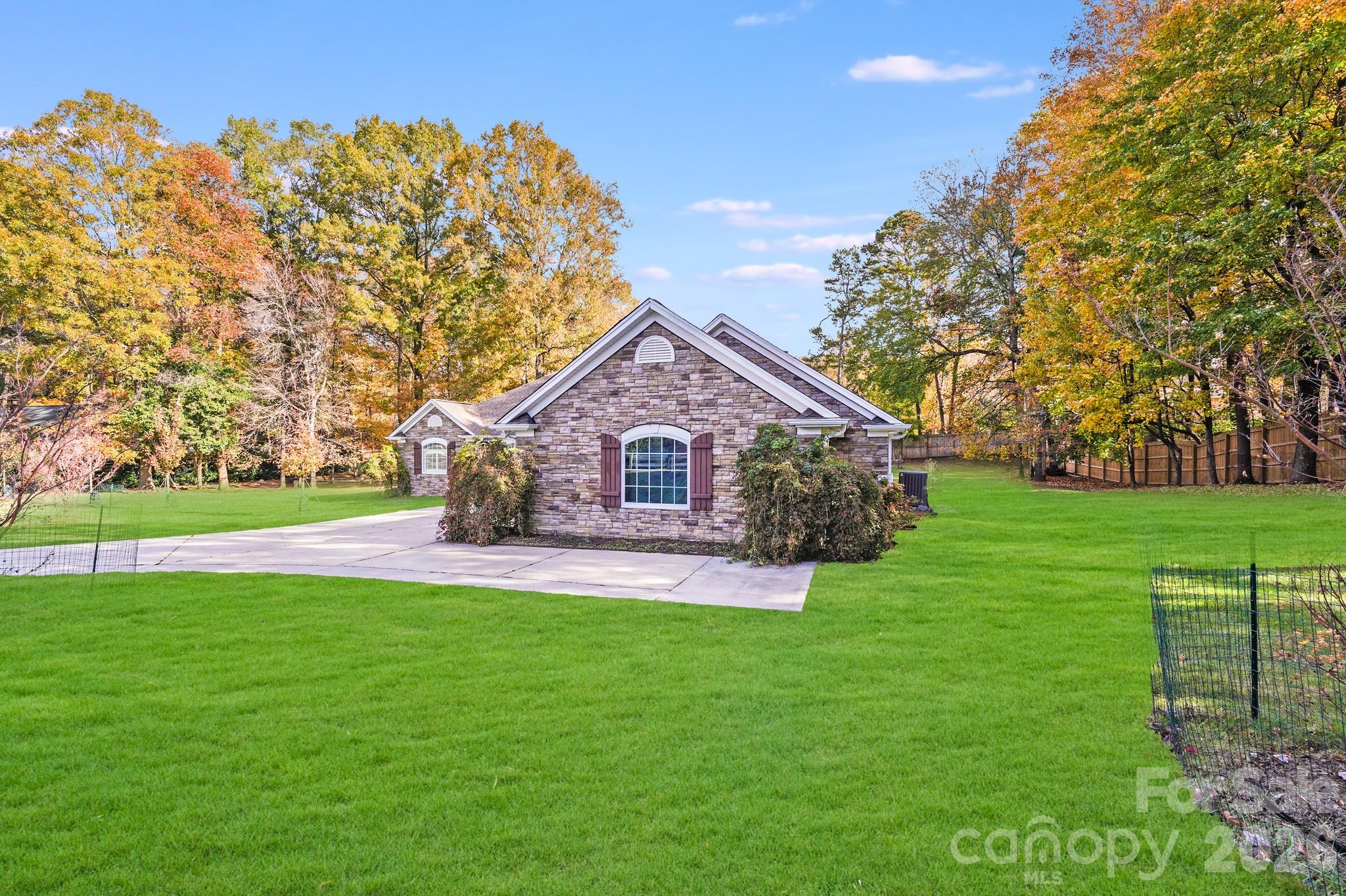 5329 Kuykendall Road Charlotte, NC 28270 - Photo 3 of 18 a front view of house with yard and green space