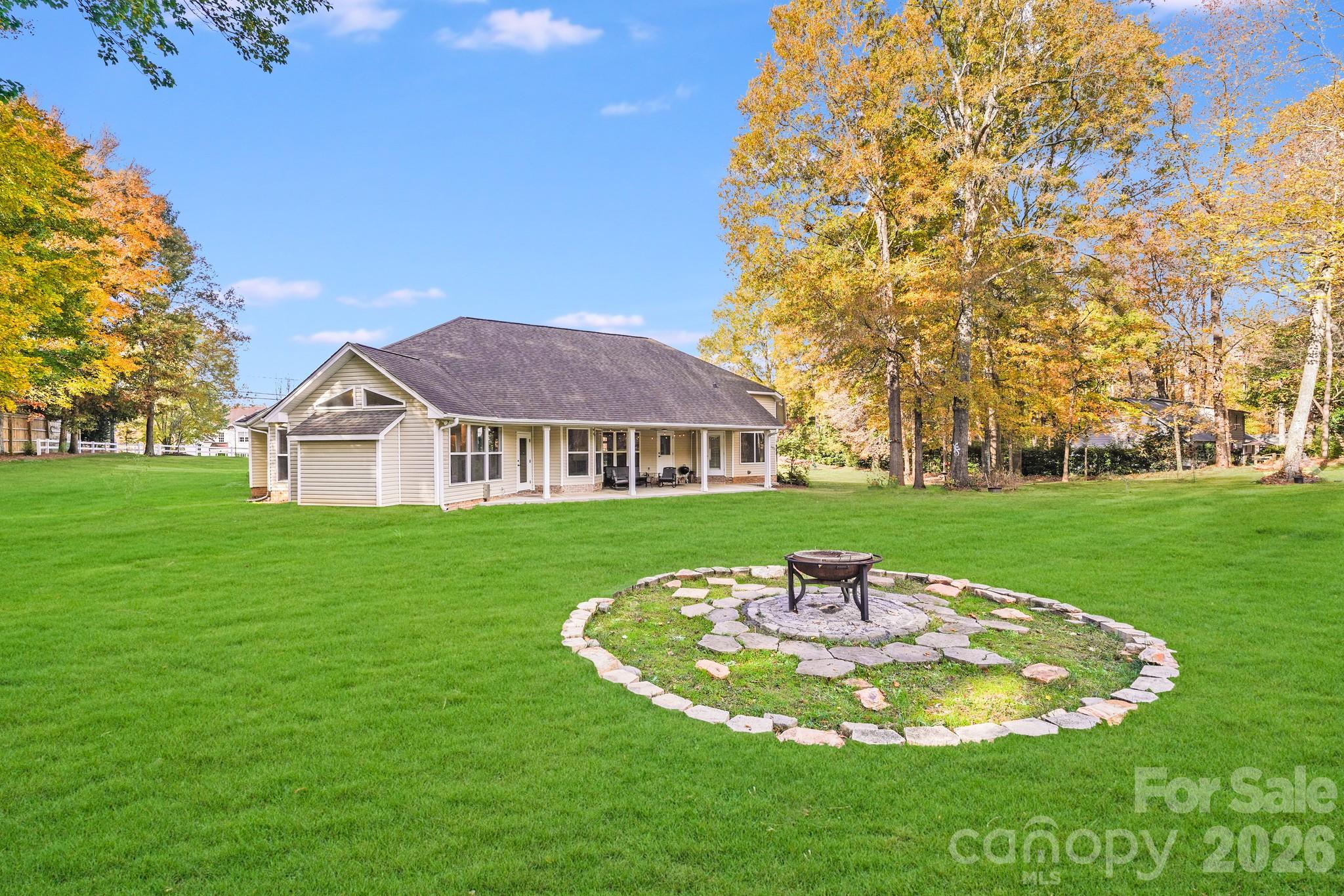 5329 Kuykendall Road Charlotte, NC 28270 - Photo 5 of 18 a view of a house with a yard