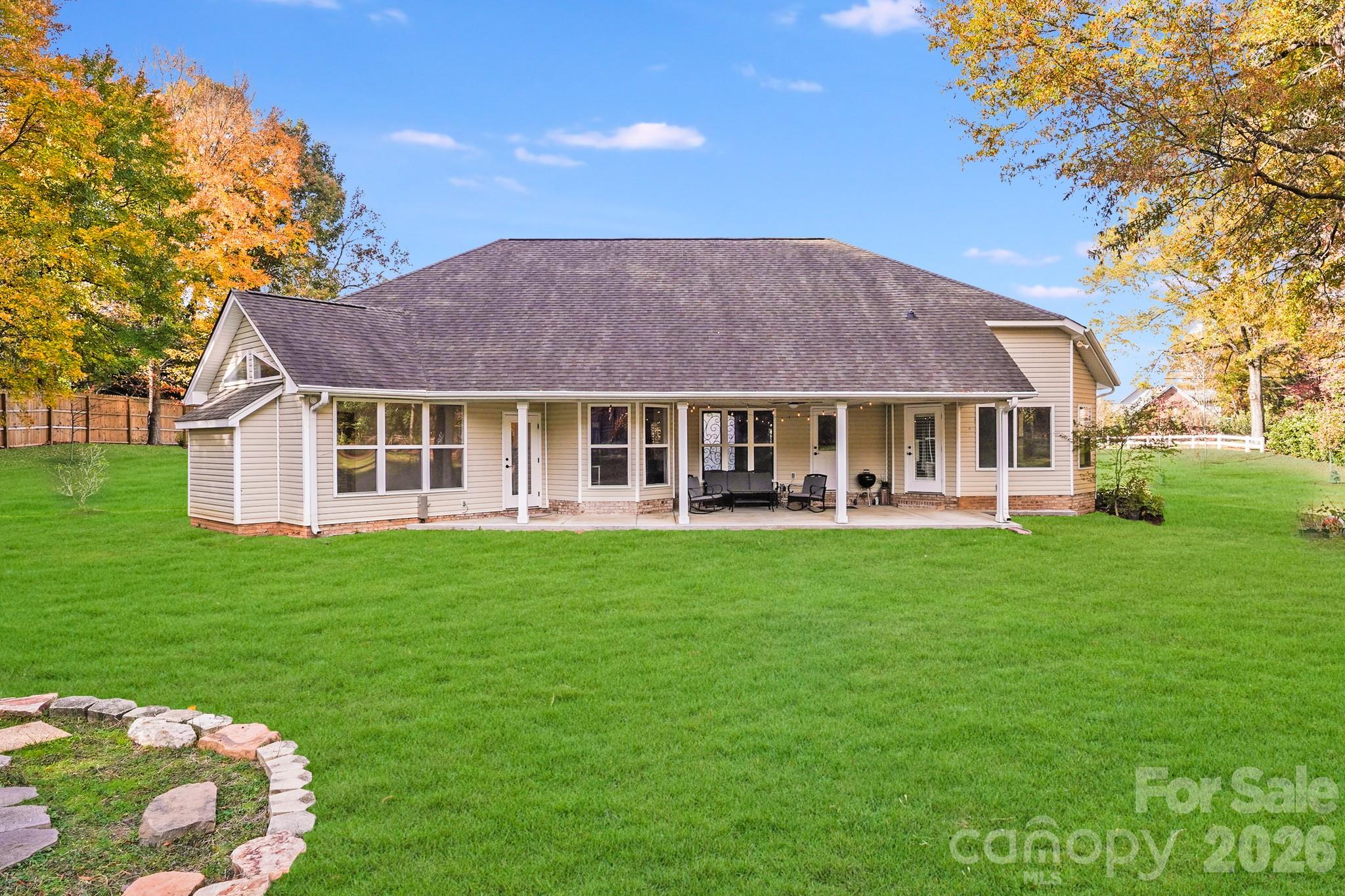 5329 Kuykendall Road Charlotte, NC 28270 - Photo 6 of 18 a front view of a house with a garden