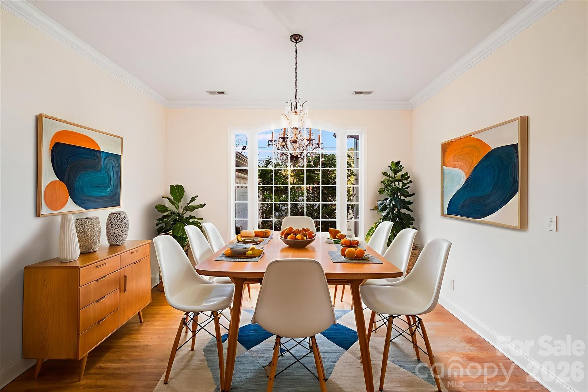 5329 Kuykendall Road Charlotte, NC 28270 - Photo 10 of 18 a view of a dining room with furniture wooden floor and a chandelier