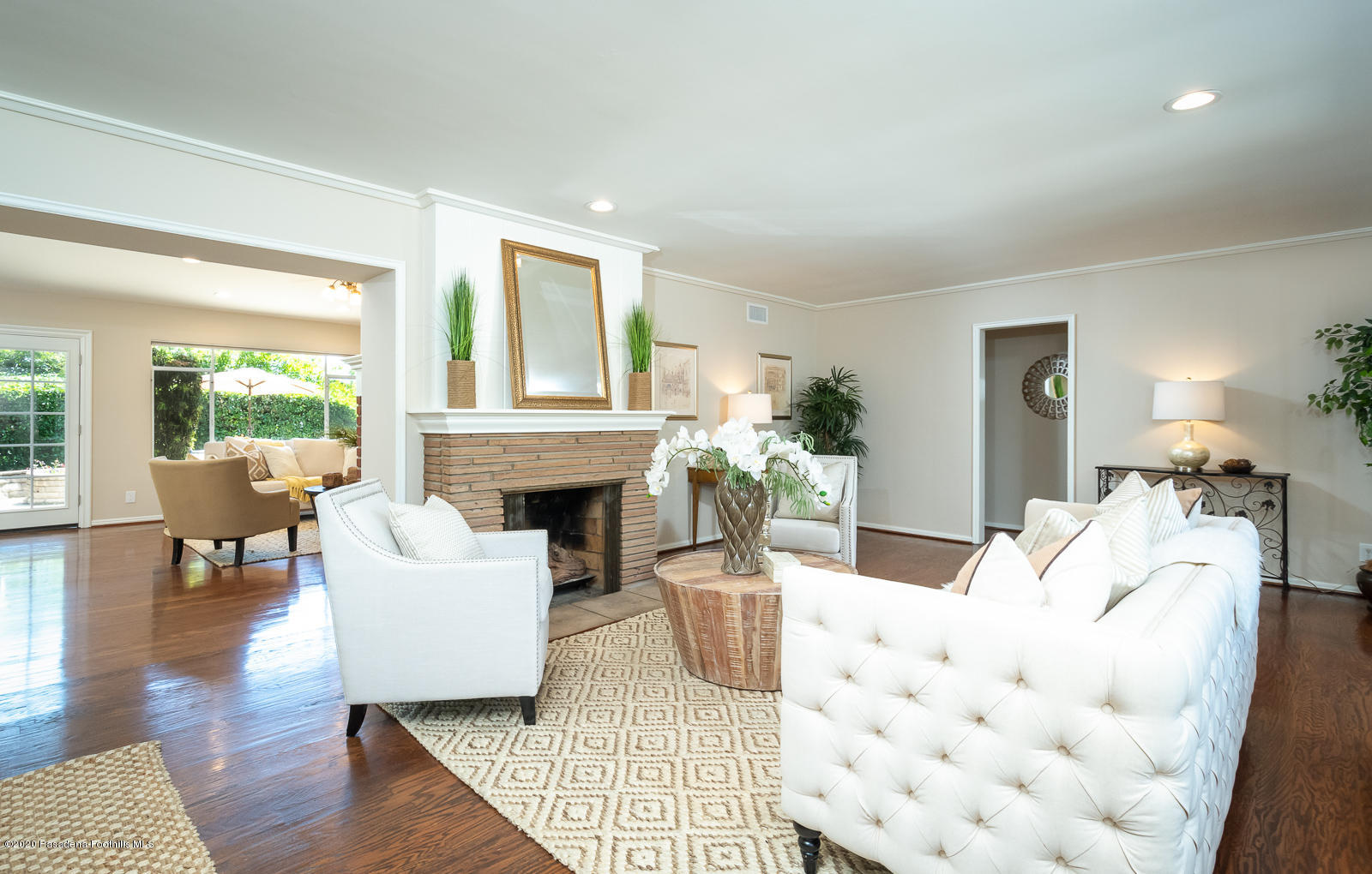 820 Chehalem Road La Canada Flintridge, CA 91011 - Photo 11 of 59 a living room with furniture a fireplace and a table