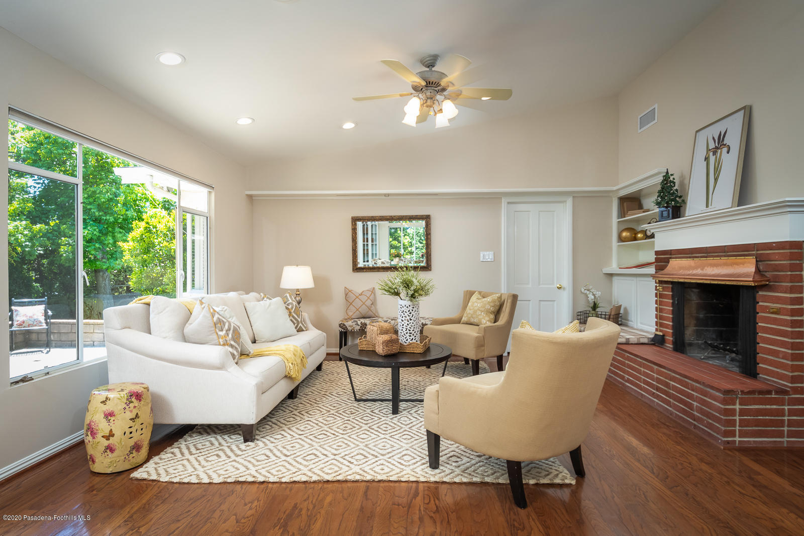 820 Chehalem Road La Canada Flintridge, CA 91011 - Photo 12 of 59 a living room with furniture and a fireplace