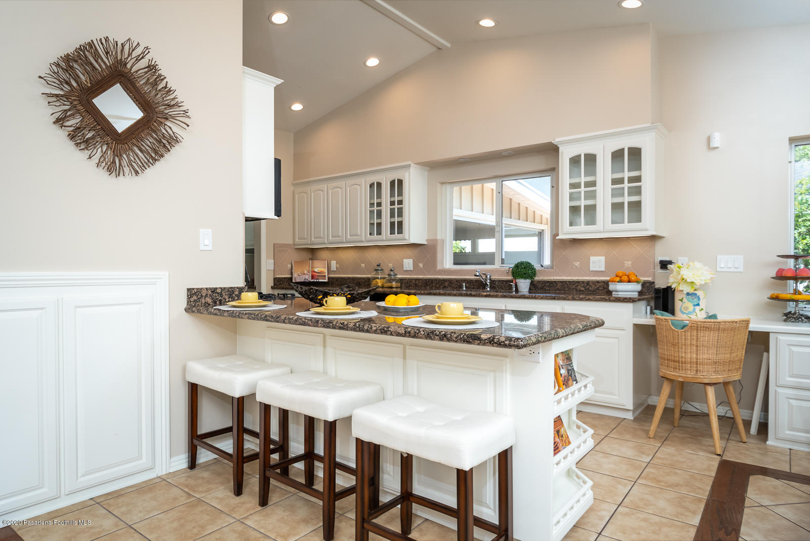 820 Chehalem Road La Canada Flintridge, CA 91011 - Photo 19 of 59 a kitchen with a stove a sink and a refrigerator