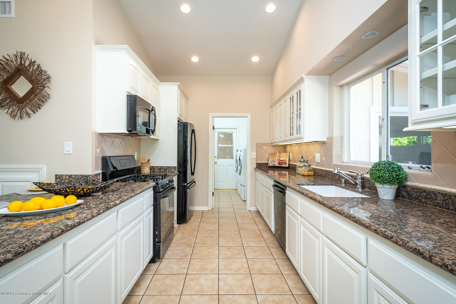 820 Chehalem Road La Canada Flintridge, CA 91011 - Photo 22 of 59 a large kitchen with stainless steel appliances granite countertop a lot of counter space and a sink