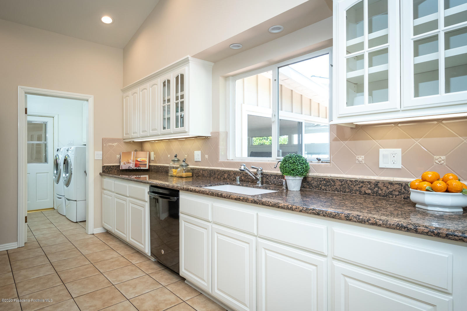 820 Chehalem Road La Canada Flintridge, CA 91011 - Photo 23 of 59 a kitchen with stainless steel appliances granite countertop a sink and a stove