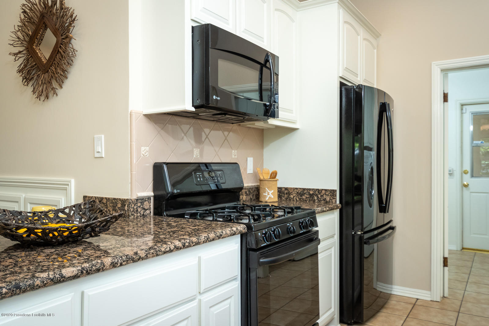 820 Chehalem Road La Canada Flintridge, CA 91011 - Photo 24 of 59 a kitchen with a stove and a microwave