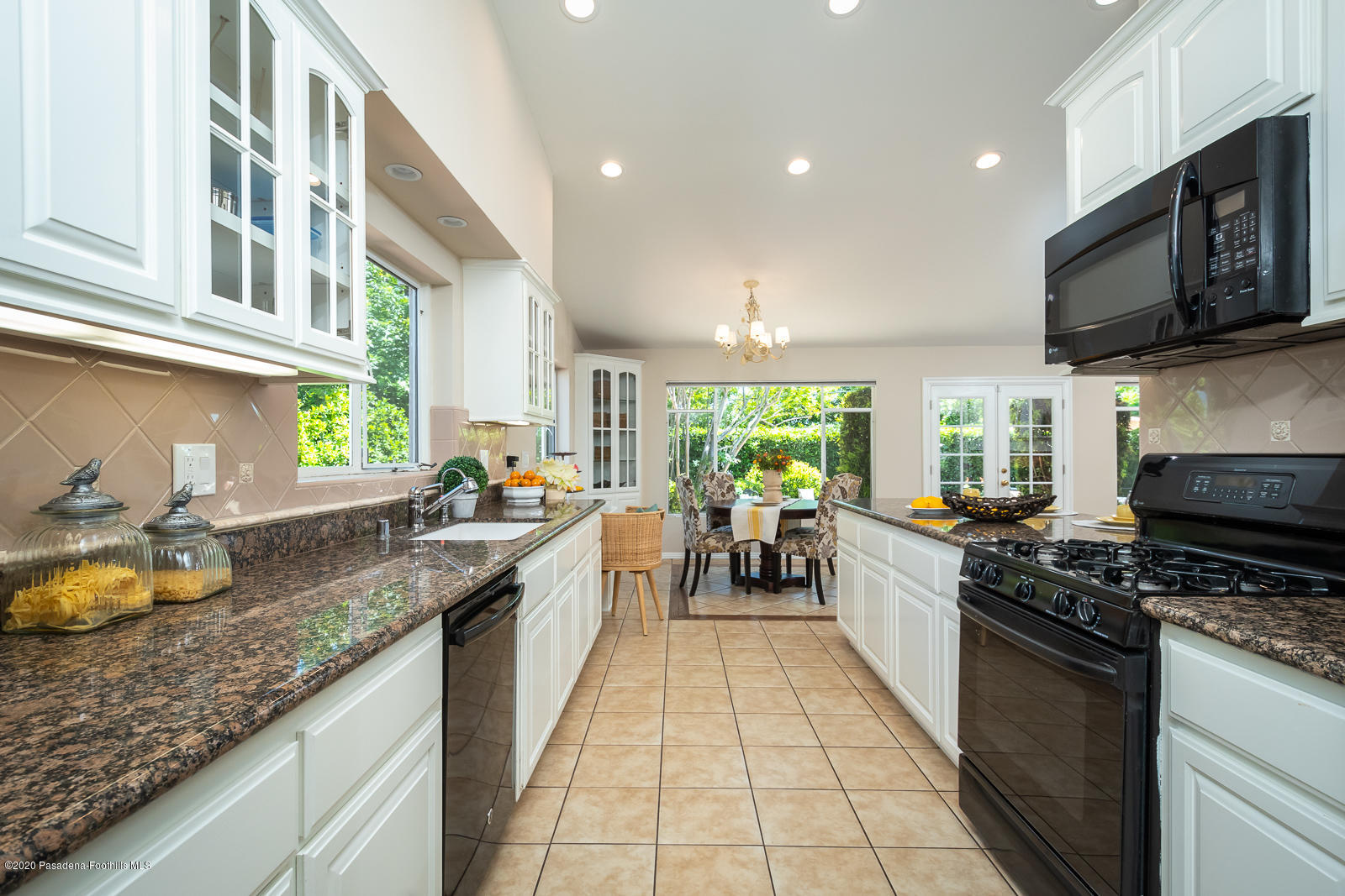 820 Chehalem Road La Canada Flintridge, CA 91011 - Photo 25 of 59 a kitchen with stove and cabinets