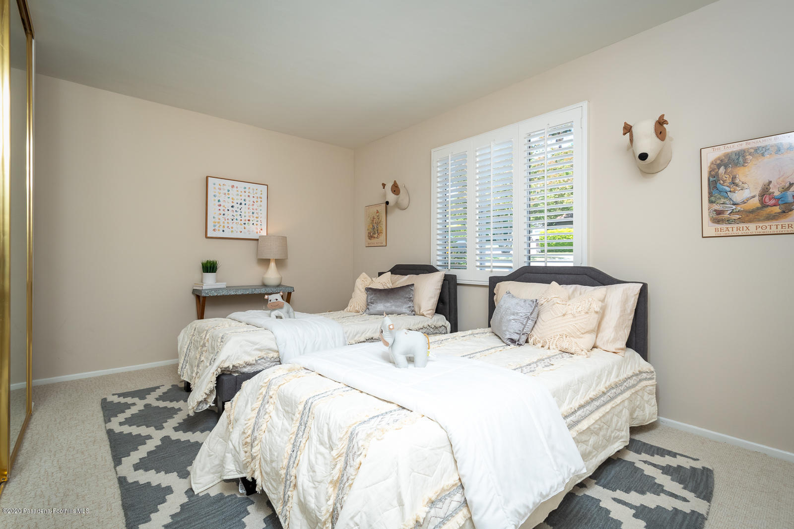 820 Chehalem Road La Canada Flintridge, CA 91011 - Photo 31 of 59 a bed sitting in a bedroom next to a window