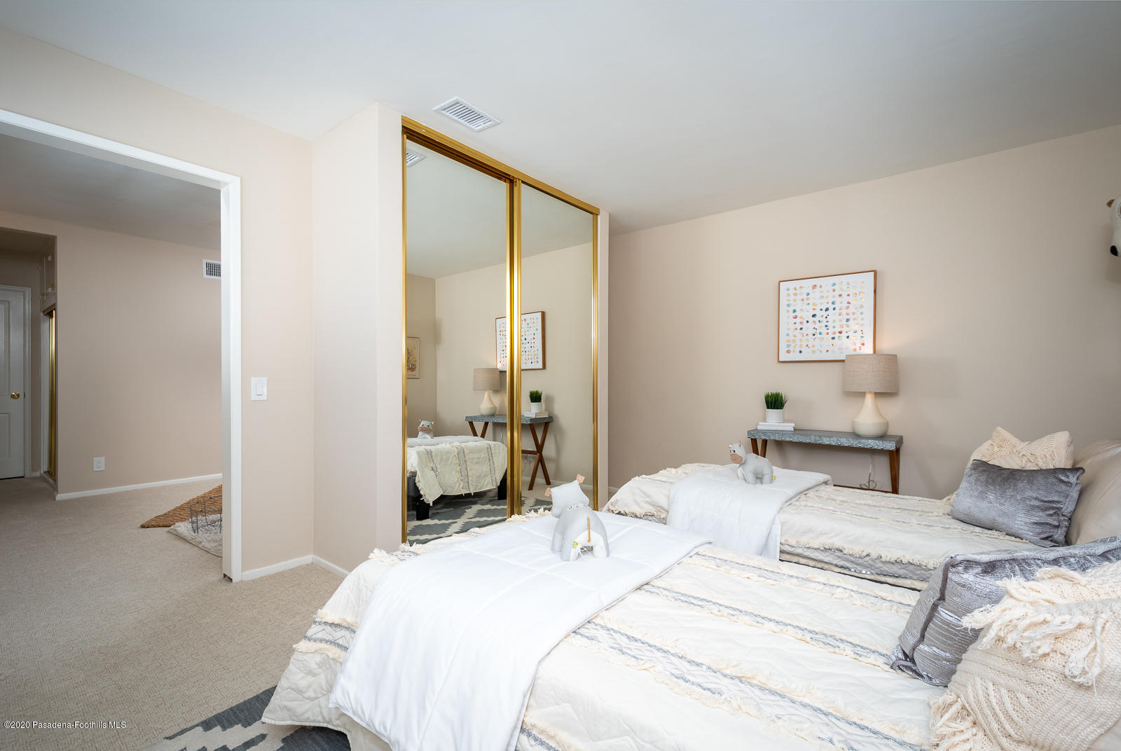 820 Chehalem Road La Canada Flintridge, CA 91011 - Photo 32 of 59 a bedroom with a bed and a large mirror