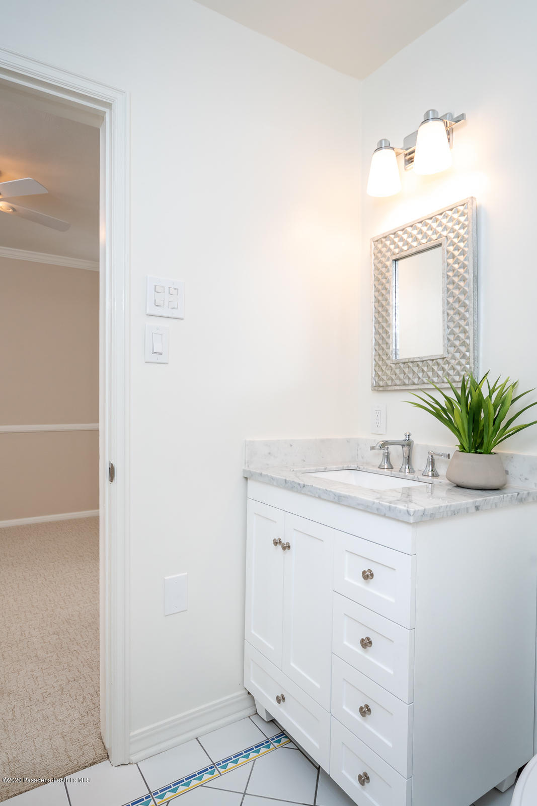 820 Chehalem Road La Canada Flintridge, CA 91011 - Photo 33 of 59 a bathroom with a granite countertop sink and a mirror