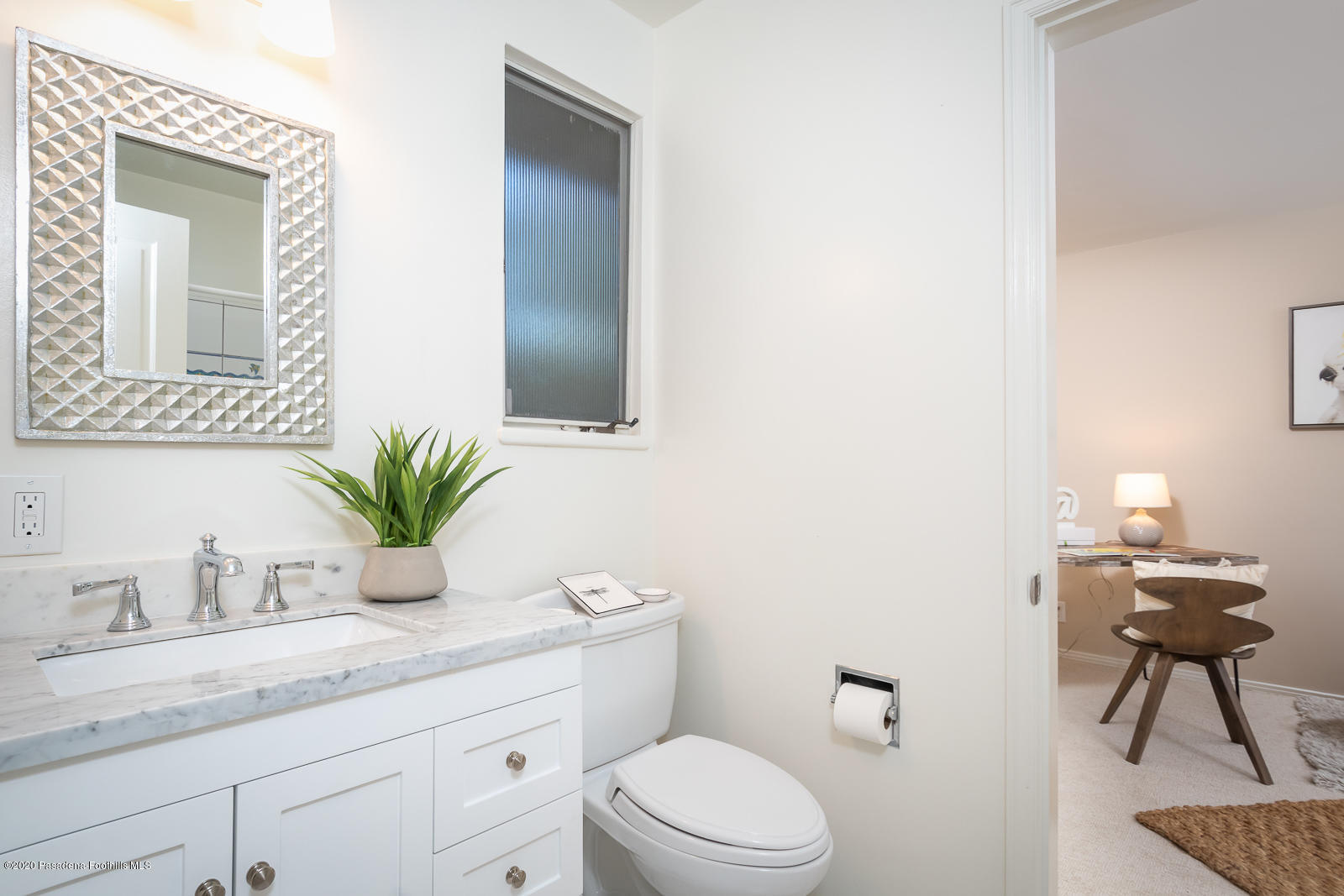 820 Chehalem Road La Canada Flintridge, CA 91011 - Photo 34 of 59 a bathroom with a granite countertop sink a toilet and mirror