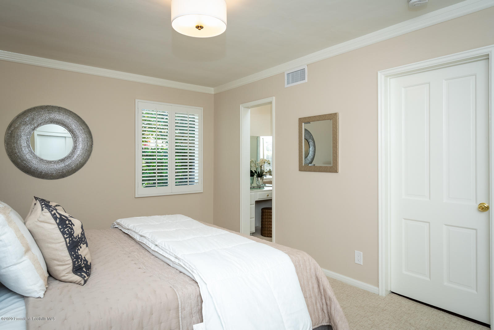 820 Chehalem Road La Canada Flintridge, CA 91011 - Photo 42 of 59 a bedroom with a bed and a chandelier