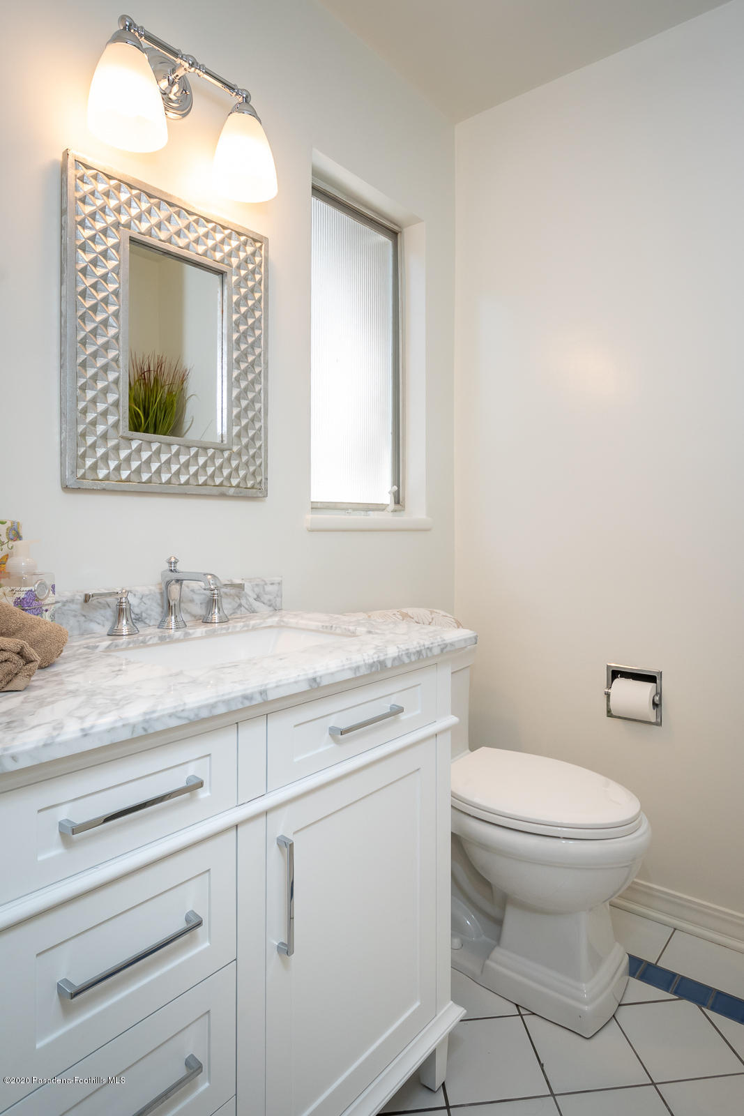 820 Chehalem Road La Canada Flintridge, CA 91011 - Photo 45 of 59 a bathroom with a granite countertop toilet sink and mirror