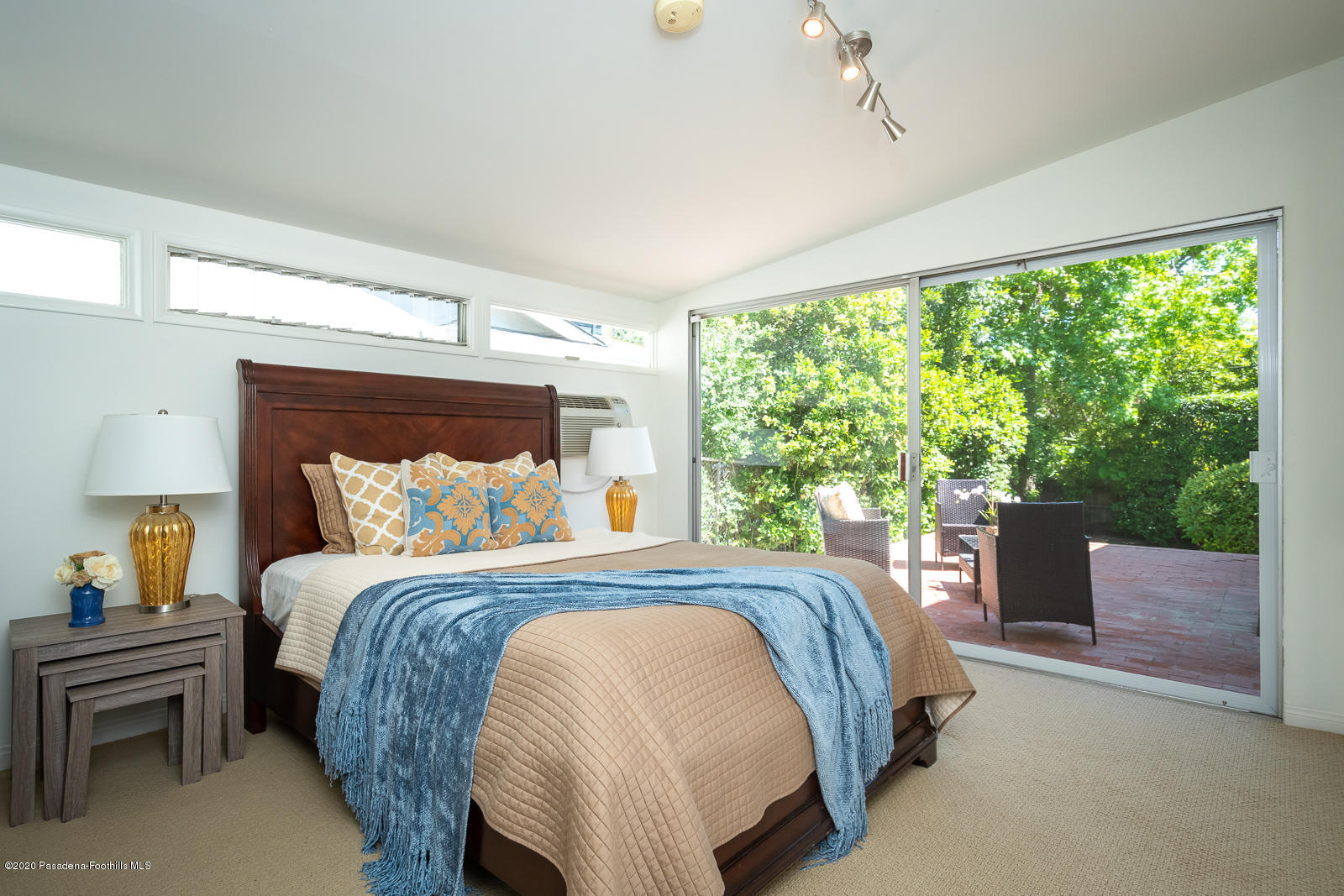 820 Chehalem Road La Canada Flintridge, CA 91011 - Photo 47 of 59 a bedroom with a bed and large windows