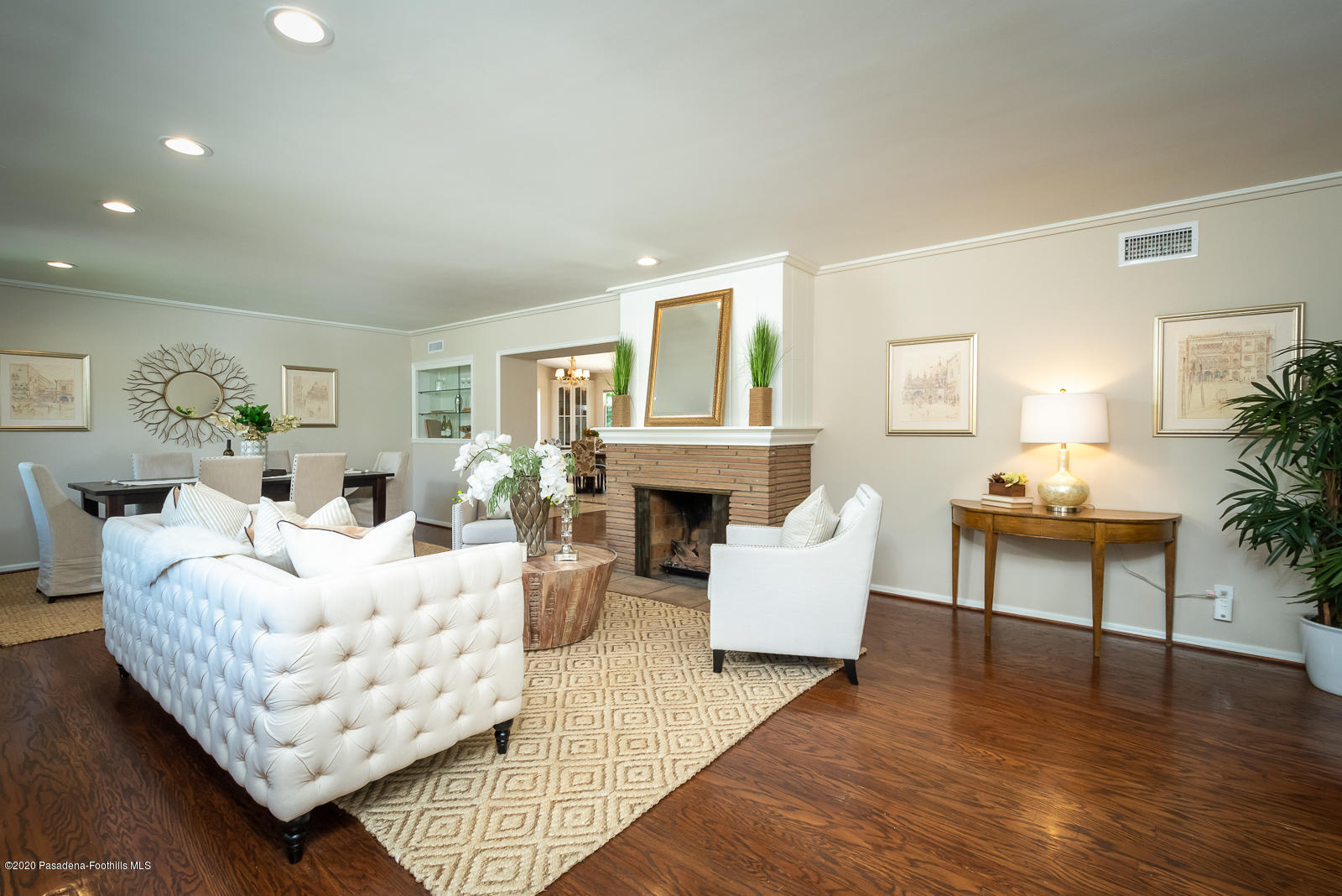 820 Chehalem Road La Canada Flintridge, CA 91011 - Photo 7 of 59 a living room with furniture a fireplace and a table