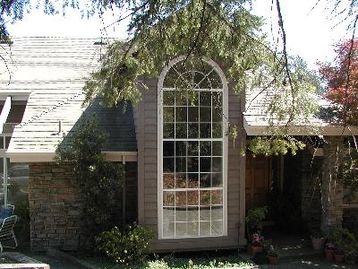 1855 Happy Valley Road Santa Rosa, CA 95404 - Photo 9 of 11 a view of a house with a yard and potted plants