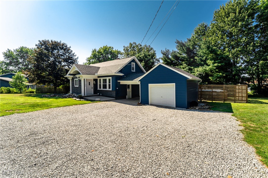 33384 Chestnut Ridge Road North Ridgeville, OH 44039 - Photo 2 of 30 View of front of home with gravel driveway and a garage