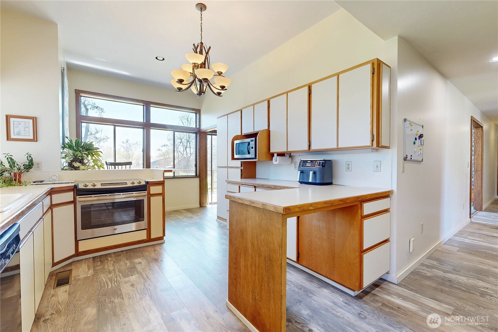 457 Prospect Avenue Walla Walla, WA 99362 - Photo 13 of 40 a kitchen with stainless steel appliances granite countertop a stove and a refrigerator